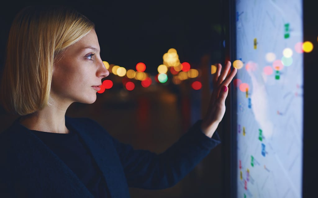 woman using interactive digital display